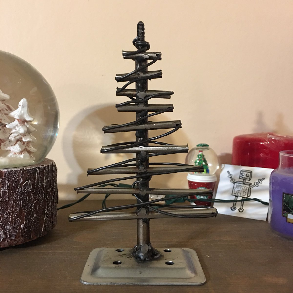jonnysweld's tweet photo. Iβve had this tree idea stuck in my head the last few weeks and itβs feels great to bring it to life. My wife added lights. #christmastree #tree #christmas #weldart #art #metalart #metaltree #mig #metal #welding #weld #welder #xmas #jonnysweld https://t.co/4X1VpmfVlE