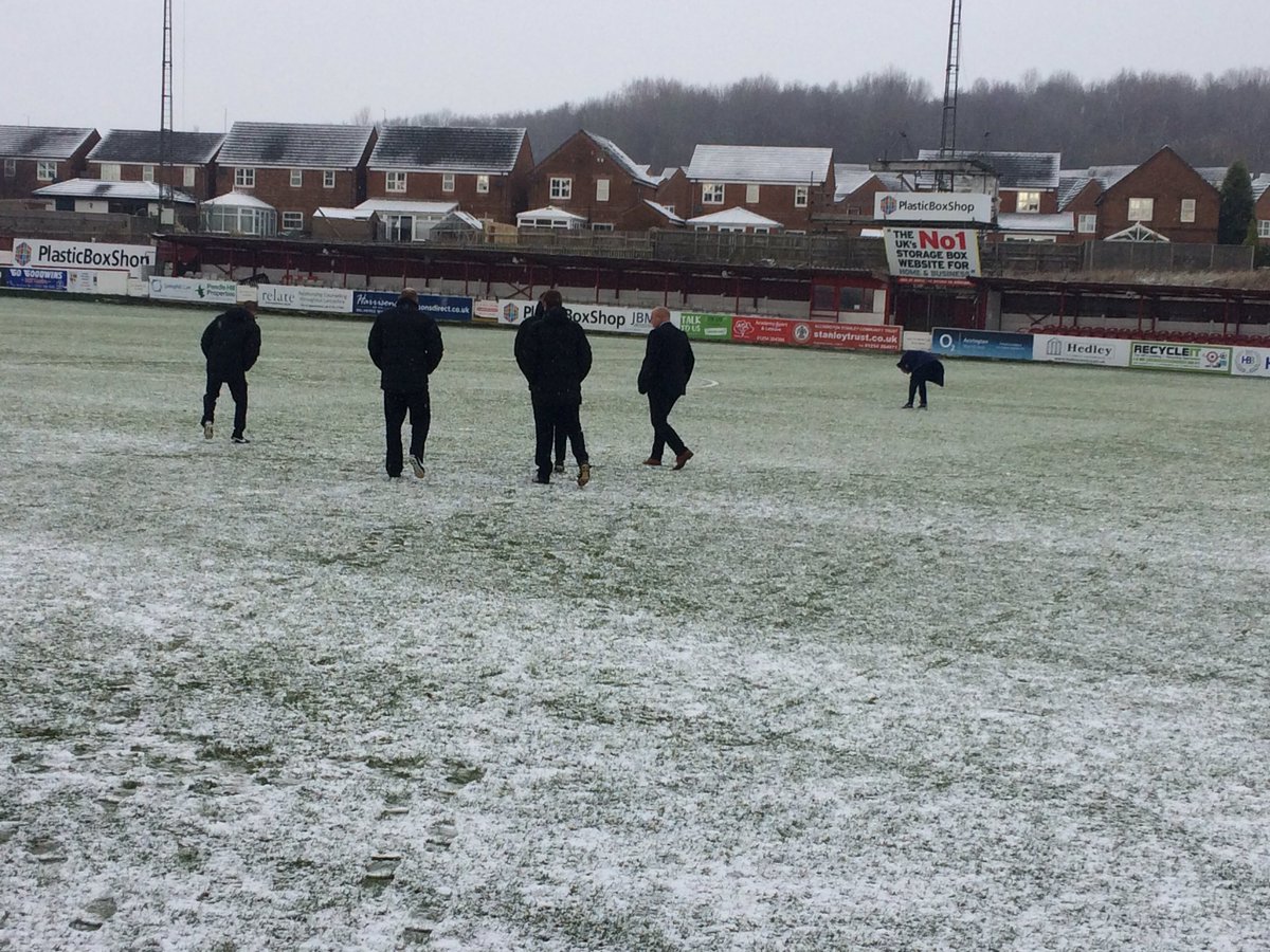 Referee David Webb examined the pitch with his fellow officials and said it was unplayable.
