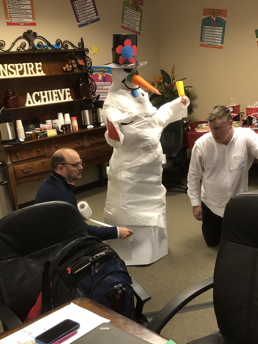 Rob and Rick put finishing touches on team snowman during Trainer update In Kagan office