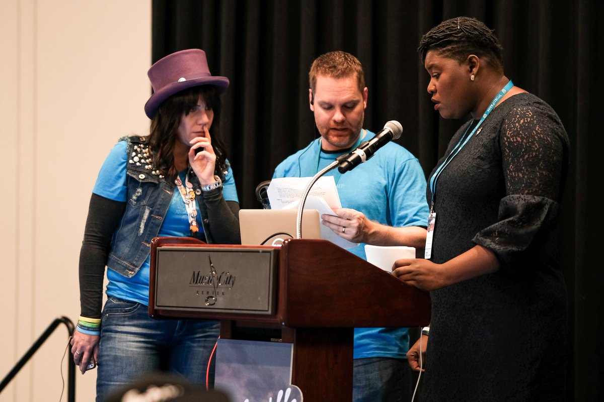 WCUS speakers and emcees preparing for a new session. Photo Credit: Sam Hotchkiss