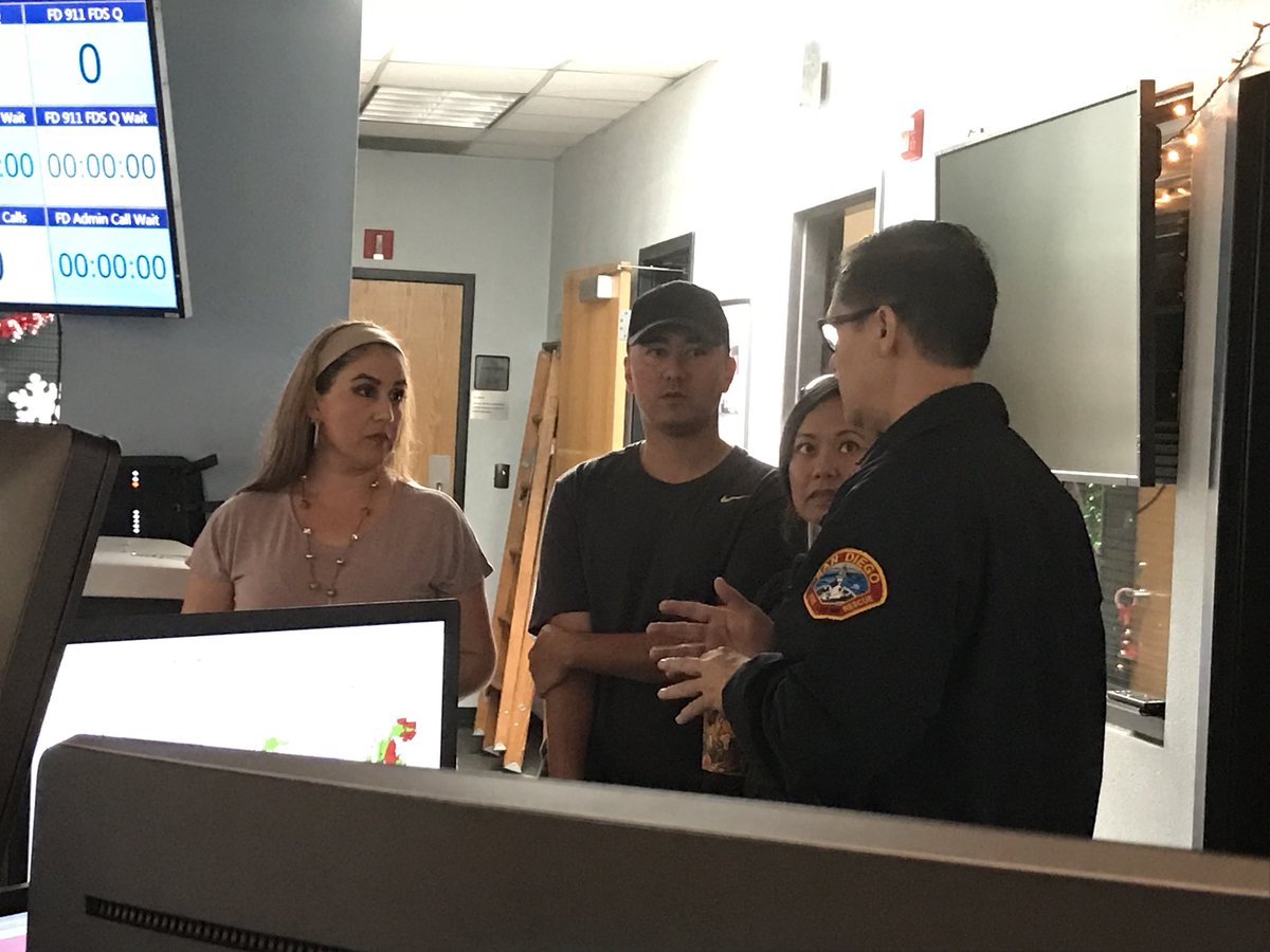 SDFD's tweet photo. @chrisjcate and his wife Maria visit our communications center this morning. They received a briefing from dispatch supervisor Cynthia Gonzalez and Dep. Chief Roger Fisher as well as our General Atomics partners. https://t.co/kkncvbudGn