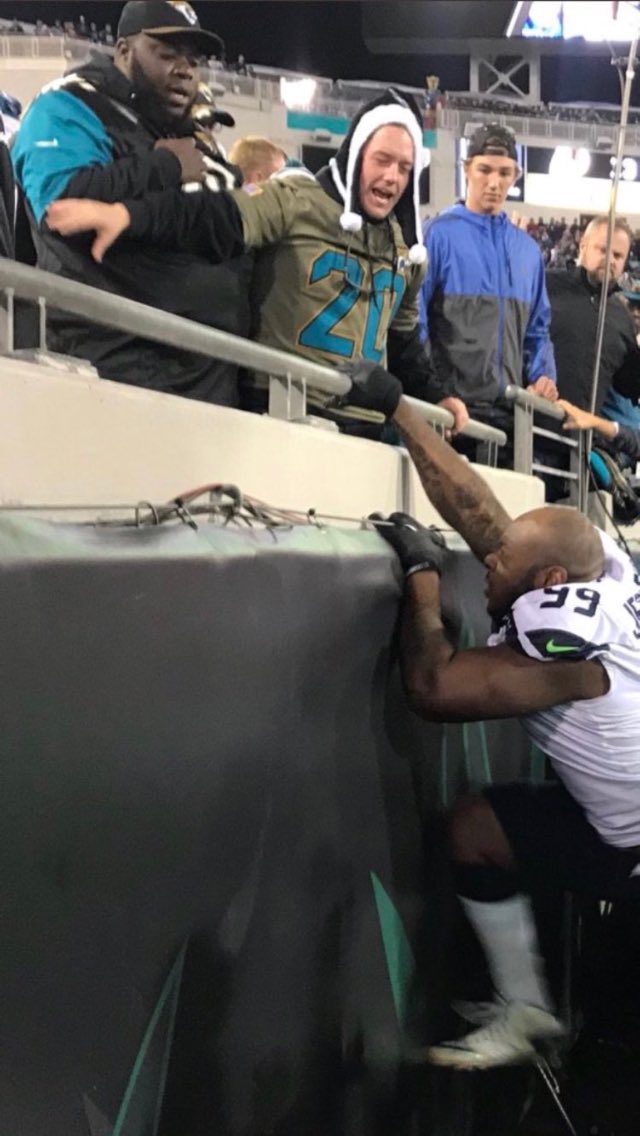 LHyning's tweet photo. This picture was captured at the same moment this fan was questioning whether or not Jefferson could actually get his big ass over those rails. 😂 #SEAvsJAC https://t.co/PieYrBGJNC