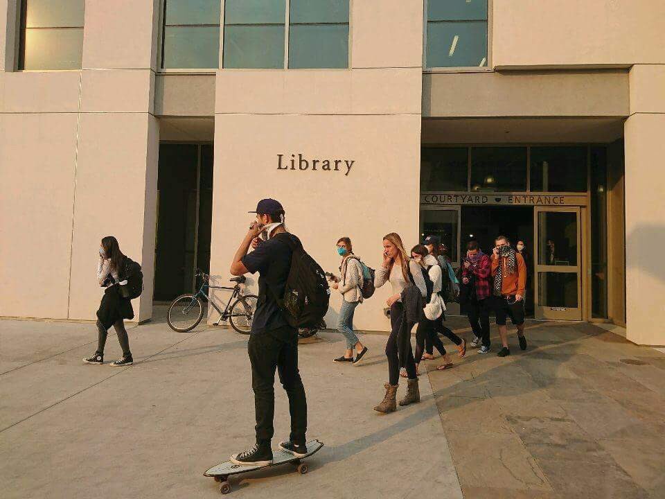 dailynexus's tweet photo. Following Chancellor Yangโs decision to postpone finals to the week of Jan. 8, students leave Davidson Library and celebrate, respectively. https://t.co/zaxCRYrZrM