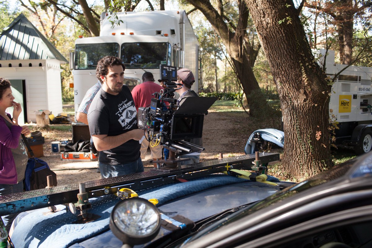 LongShadowMovie's tweet photo. #BehindTheScenes of @thelongshadowm1 Director Daniel Lafrentz checks the hood mount before a drive through the sugar cane. #Boys&amp;TheirToys https://t.co/vjuJsswDOS