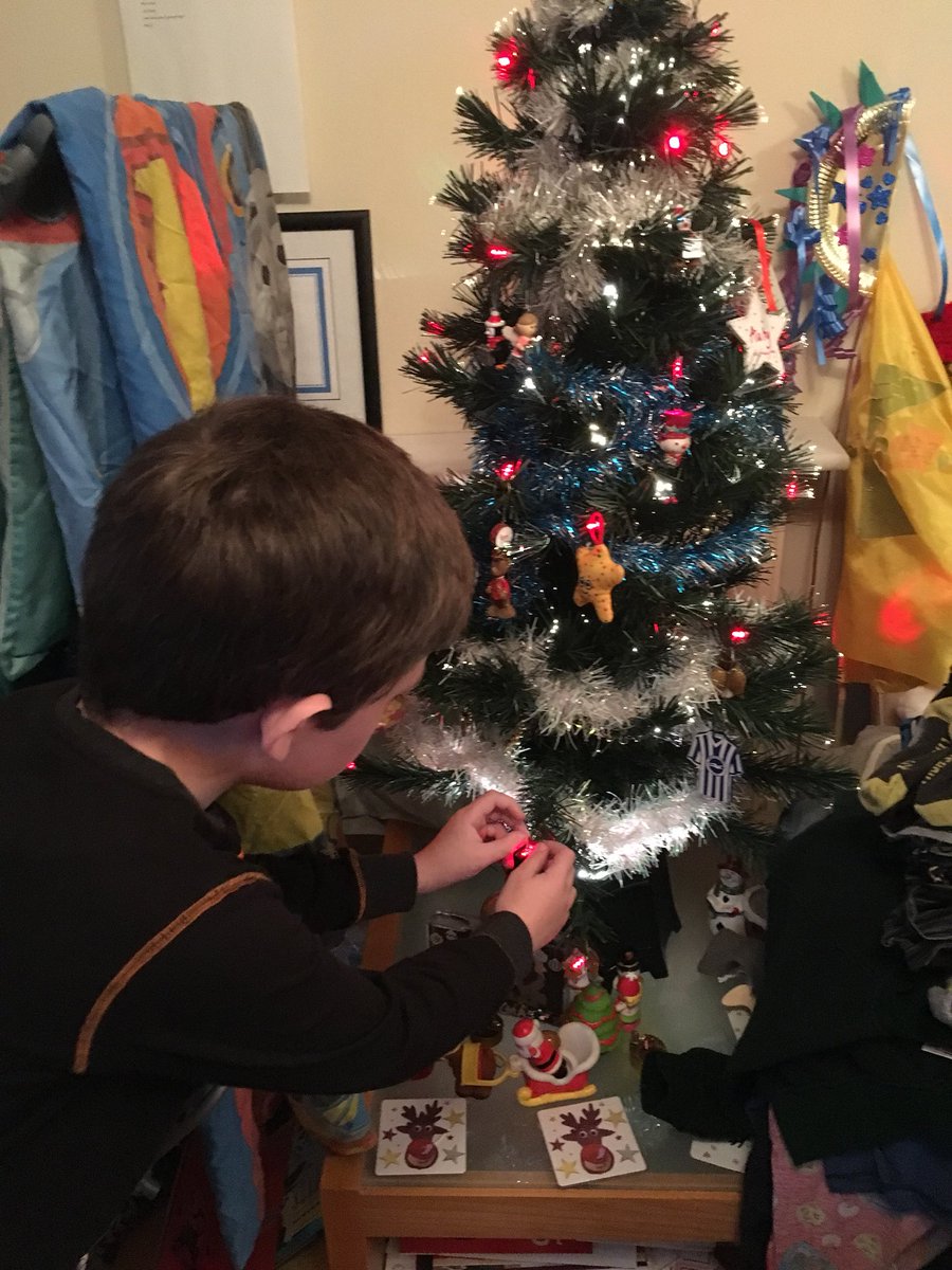 AutyWarriorMum's tweet photo. Ryan’s finally embracing everything that is Christmas&amp; @cookie337 &amp;I r so overwhelmed.Waited many years4this,Ryan wants2b involved.Left tree decs out&amp;said2him”Ryan can put them wherever he wants.”He LOVED it,wiv reassurance,cracking job #BestChristmasTreeEver 😊👍🏻❤️🌈🎄🎅🏻🎁 https://t.co/ddyOc945zl