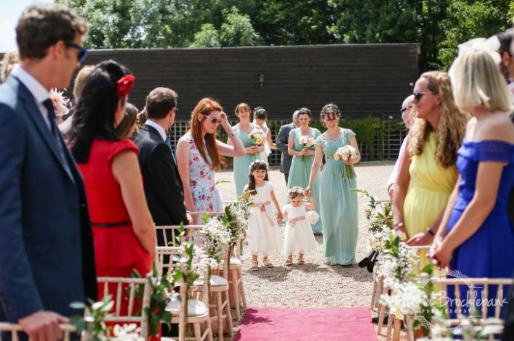 Here comes the bride... and look at those pretty #flowers down the aisle!! #florist #surrey #weddings