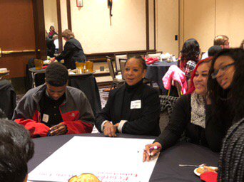 Manual students working in violence prevention document at summit.#ylps2017