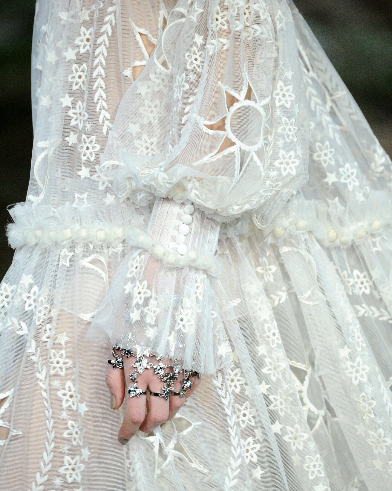 Alexander McQueen on X From the archive Autumn Winter 2014. A close up of a moon and stars embroidered dress worn with star hand jewellery and photographed on the runway. McQueenArchive AlexanderMcQue...
