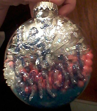 We made Christmas ornaments filled with candy and decorated by the kids!! Best and cutest idea ever!!