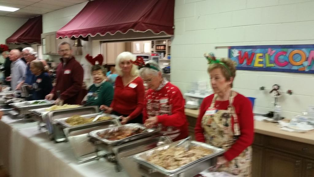 CurtGronert's tweet image. Linda et al serving Christmas dinner