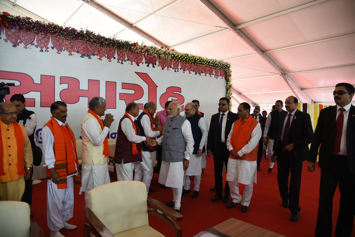 narendramodi's tweet photo. Congratulations to Shri @vijayrupanibjp, Shri @Nitinbhai_Patel and all those who took oath as Ministers. My best wishes to this team in their endeavour to take Gujarat to new heights of progress. https://t.co/X7Kt56u3vC