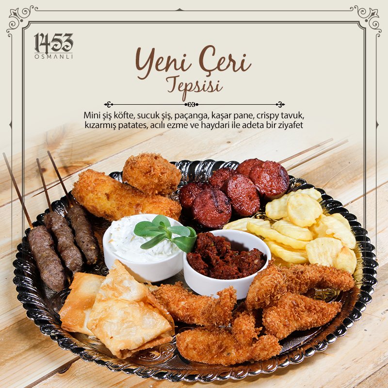 Mini şiş köfte, sucuk şiş, paçanga, kaşar pane, crispy tavuk, kızarmış patates, acılı ezme ve haydari ile adeta bir ziyafet: Yeniçeri Tepsisi!