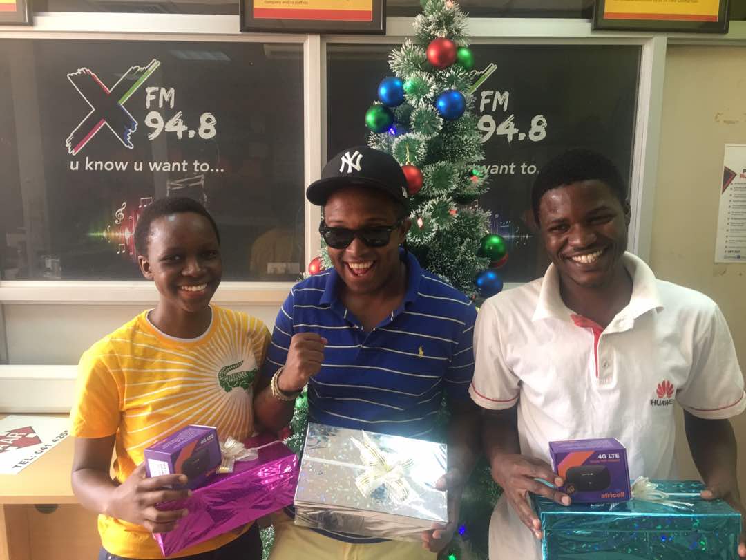 lordghill's tweet photo. Congratulations to Gloria and Derrick who just won themselves Mifis from @africellUG ! Stay tuned to 94.8 @XfmUG and you too will win a gift from under our #LitMas tree!!! #XfmLitMas https://t.co/Yi9fAvPDjK