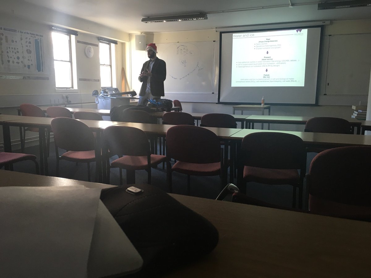 LabGibson's tweet photo. Our newest colleague @warwickchem Garbrielle Sosso telling us about MD of Ice/Water interfaces. #xmasscience (with compulsary Santa Hat) https://t.co/CccMxWJbyO