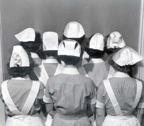 aorn's tweet photo. #TBT Various styles of nursing caps modeled by student nurses from around the region. Each School of Nursing had its own distinct uniform for its students, as is witnessed by this photograph. (Via Penn Medicine Nursing Collection, year unknown) https://t.co/gKqtsletLE