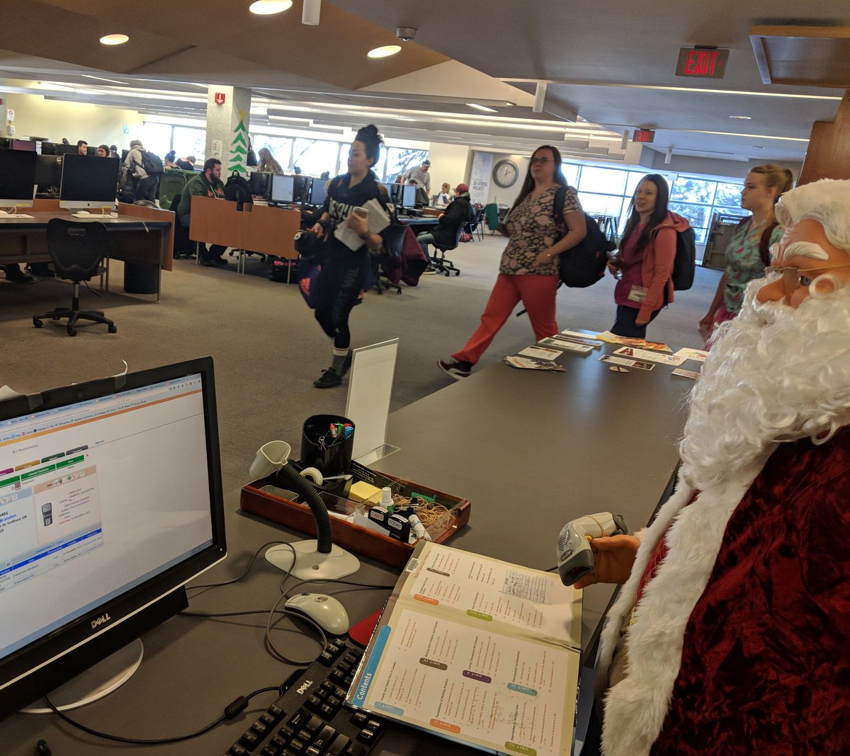 CambrianLibrary's tweet photo. It sure is busy in the library today - good thing Santa is here to help us out! #librarianforaday #cambriancollege https://t.co/dI3kBCMNGT