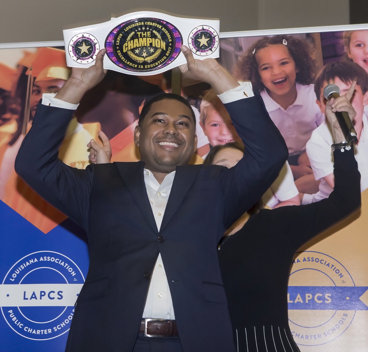 croemer's tweet photo. Glad to be surprised with a Charter Excellence Award as an Education Champion—Check out the belt! I have enjoyed every minute of my 10 years as Executive Director!#LAPCS10 https://t.co/1B3rJUM6Nu