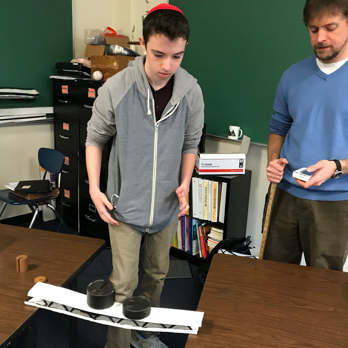 curtisPLTW's tweet photo. Introduction to Engineering Design students testing bridges in Mr. Mickelson’s Geometry Honors class @ETHSMathematics! #WildkitEngineering #wildkitway #ETHSCTE https://t.co/1fRO2ORIGK