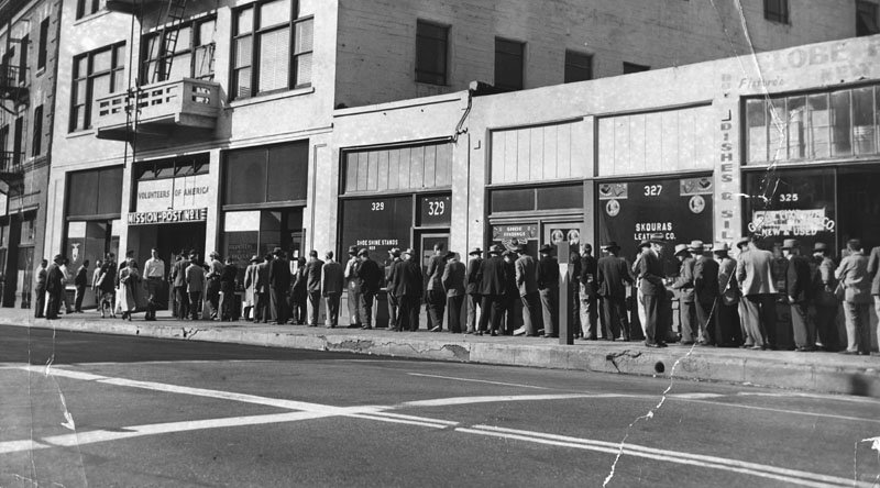 People lined up for Christmas dinner in front of the Volunteers of America's mission post No. 1 on Skid Row on December 25, 1950