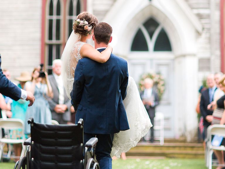 The touching moment a groom carried his bride down the aisle: trib.al/A2WfMKb