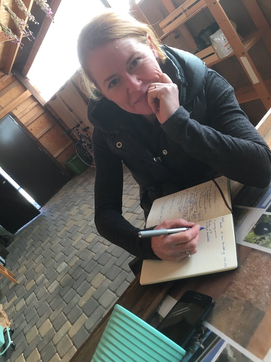 Veggielution's tweet photo. How Veggielution does conference calls. Give us a quiet farm stand, an empty herb vase and we got this. #nonprofithustle #communitybuilding #ESJ #fundraising #takennotes #takennames #takengrants https://t.co/5x2sITAPin