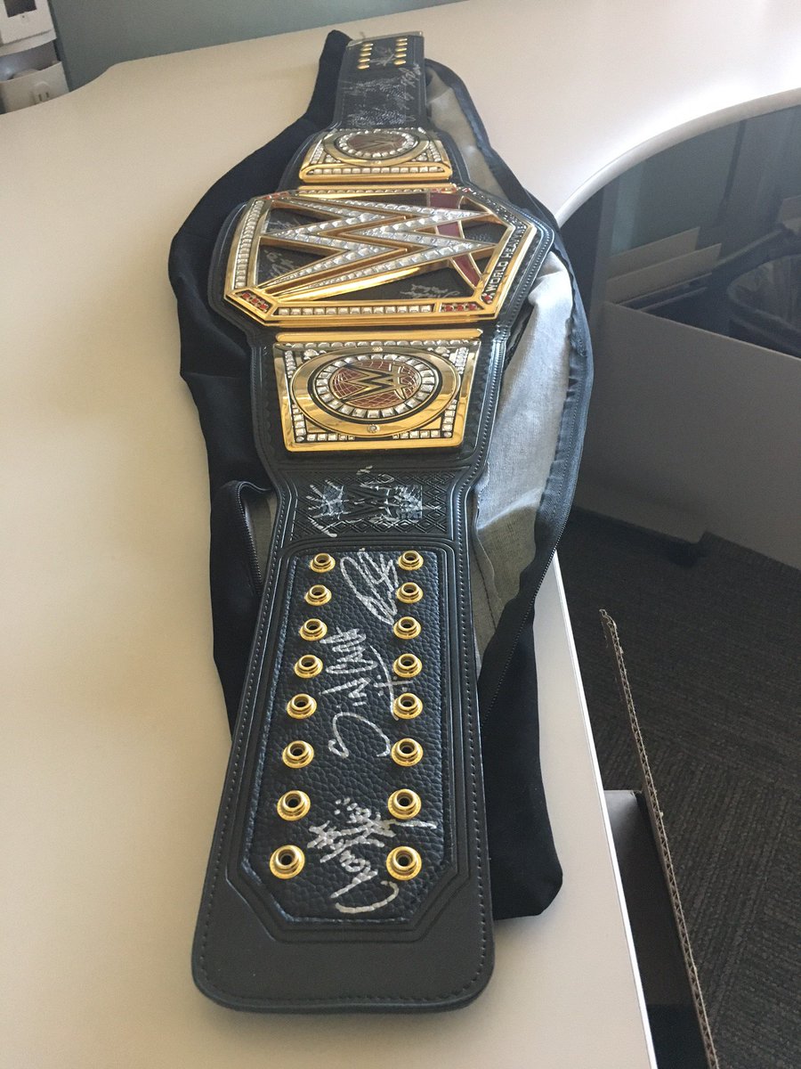 WWEgames's tweet photo. Find out who won this signed WWE title replica (both sides!) in the #WWE2K18 #Promos4Promos contest! https://t.co/XSZTYtjGvf https://t.co/XX2DfgbEYT
