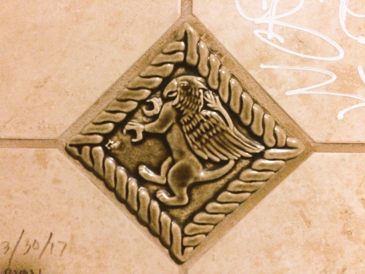 MickLauer's tweet photo. Graffiti and griffins in the bathroom stall. Love it #aaavo https://t.co/YijjdEl98j
