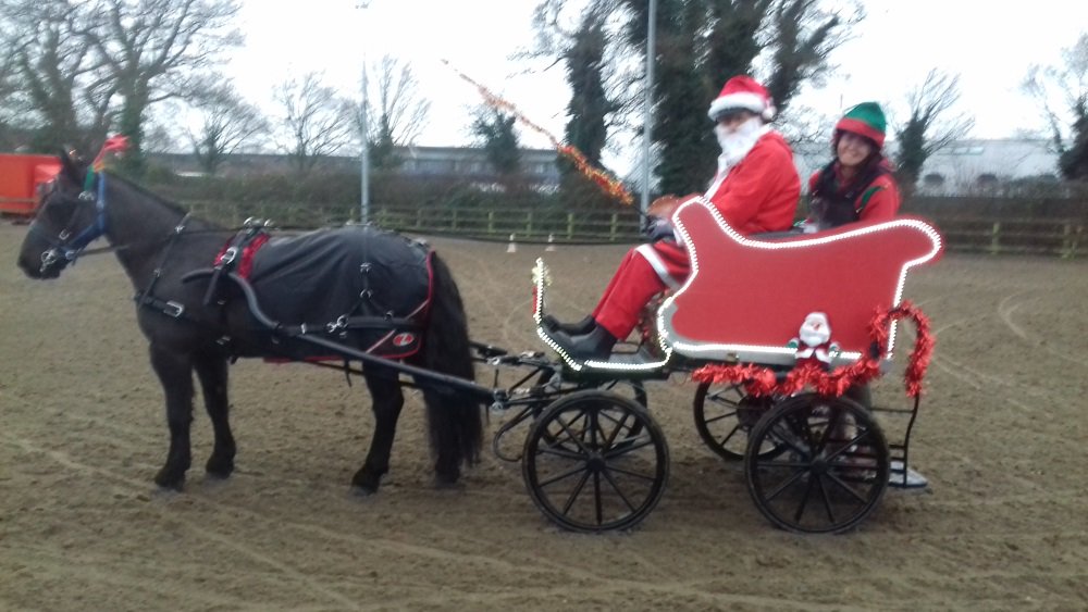 A festive picture from Pat and Richard:
“A very cold and wet Richard, Charlotte and Thomas "warming up" before the P and P at Easton College; our effort was worth it because we won a prize in the fancy dress and we also secured the red rosette in the club class"