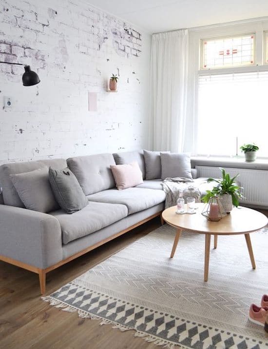goodhomesindia's tweet photo. We absolutely love the white brick wall effect. What's your take on this style? #home #decor #livingroom #brick #whitewalls #minimal #table #couch #windows #wallfixture (Photograph: Bloglovin) https://t.co/0c9bpf1jE7