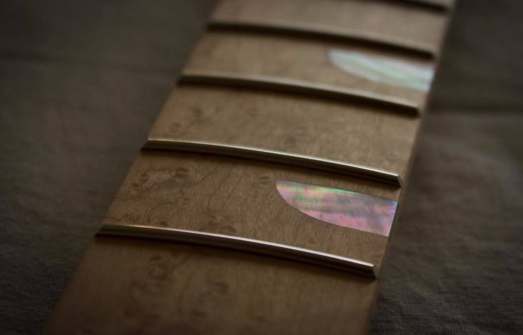 RascalGuitars's tweet photo. The many colours of mother of pearl. On closer inspection you can see that the edges of the frets have been filed to roughly 30 degrees, although in this image they’re not quite finished - additional filing will take just a fraction of a millimetre off t… https://t.co/OkY6CKdhYo https://t.co/4cZNoAWYgl