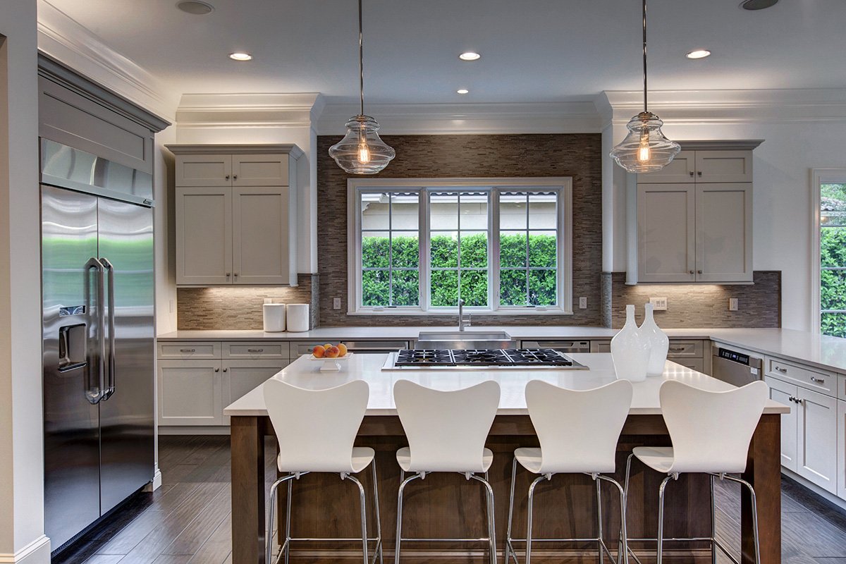 WolfeRizor's tweet photo. We designed this kitchen with a tumbled stone backsplash and custom blown glass pendant lights. We love the symmetry and light! https://t.co/GI2J7no0vw