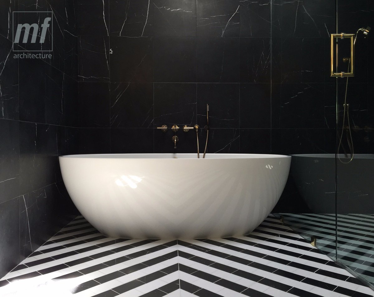 Getaway to read/drink? Simply wash up? A bathtub can be part of a spa-like experiences. The bathing area at our Binary Bathroom is spacious, filled with natural light, and finished with minimalist materials. It’s one of our most favorite spaces and part of an intense renovation!