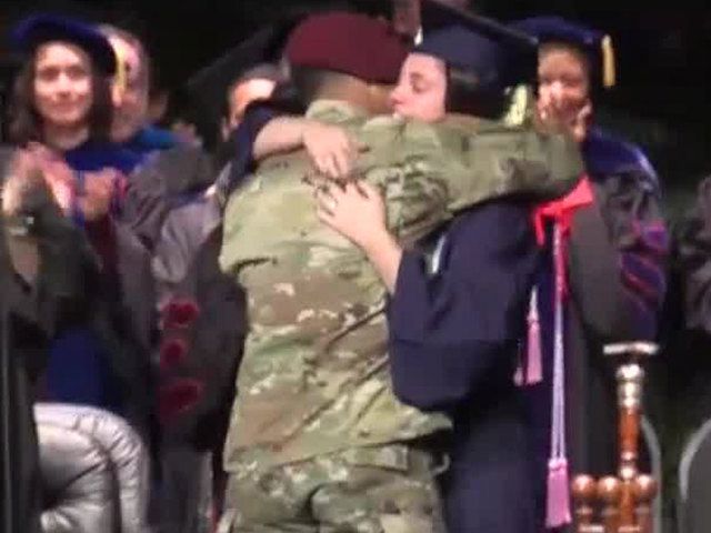 Army husband flies from Germany, surprises wife on stage at <a href="/FloridaAtlantic/">Florida Atlantic University</a> graduation bit.ly/2Cyg8kN @StephanieWPTV