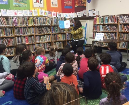 Dr. Talukdar shared books with students at a crowded Driscoll Book Fair during a special evening session.