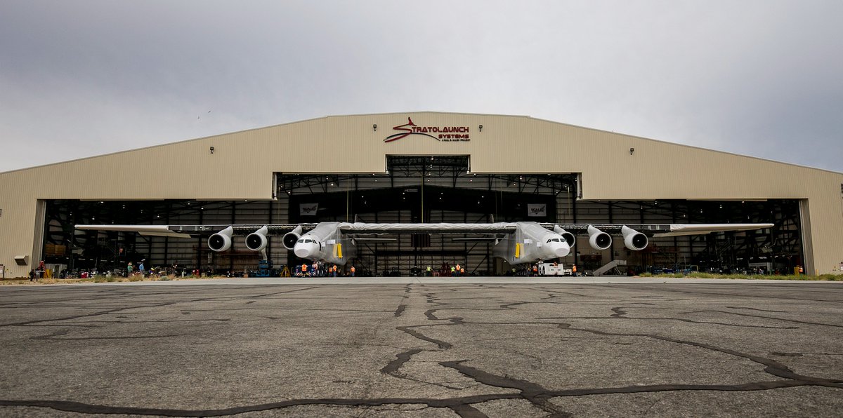 ScaledC's tweet photo. #FBF to earlier this year when we rolled out the world’s biggest plane for the first time – we’re still reeling over it! #lookatthatwingspan #385ft #justatinybitbig #Stratolaunch #Model351 https://t.co/nfGh3rPVnF