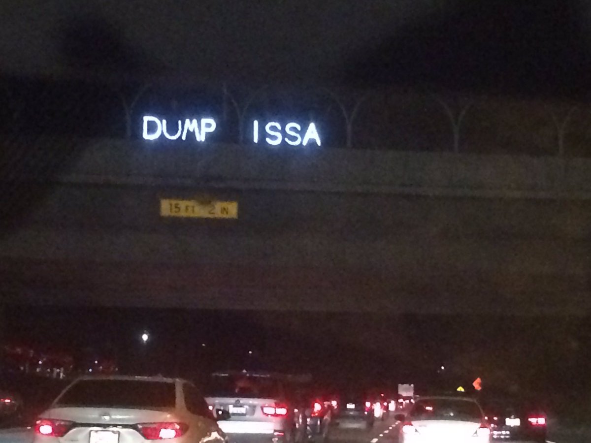 SDIndivisible's tweet photo. Here's how the #Resistance in San Diego lights up for the holidays! 🎉 We won't relent until we dump @DarrellIssa and #Flipthe49th 

Seasons Greedings, GOP! 🌲 

Props to Overpass Light Brigade ✊🏼 https://t.co/Fyj0EY3Cb1
