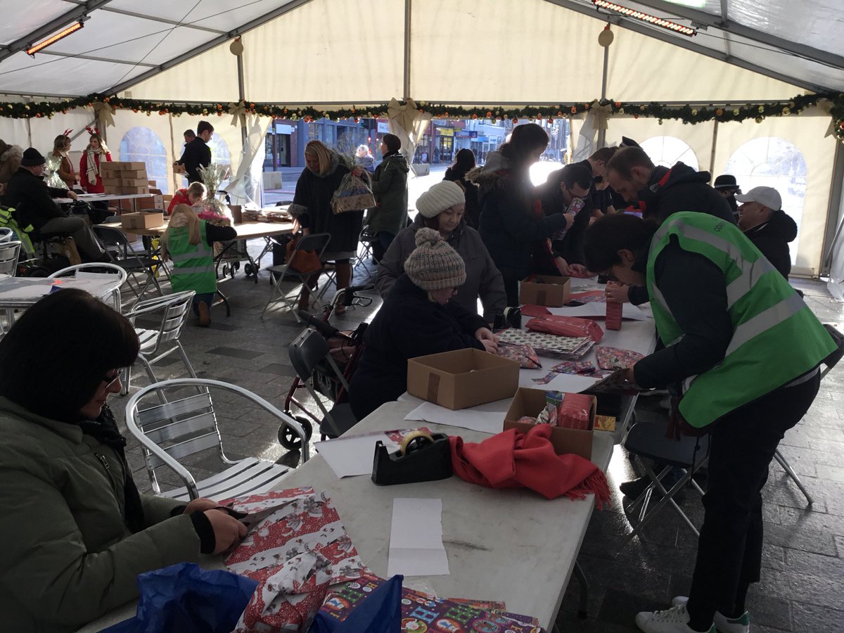 stocktoncouncil's tweet photo. Thanks to everyone who has arrived so far to wrap presents for vulnerable elderly and young people. Come along and help out too in Stockton High Street. #EventC https://t.co/S1csNa0L5F