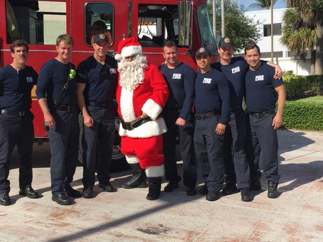 WPBfire's tweet photo. Station #2 delivering Santa to Dreher Park. The kids got to explore the fire truck and tell Santa what they wanted for Christmas. #wpbfire #santa #wpb https://t.co/Hdebe7Qx3b