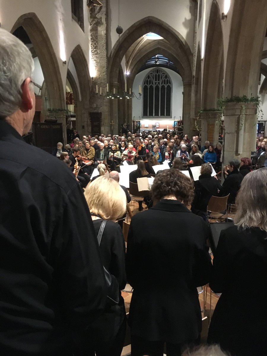 A full house as the choir comes in and the orchestra tunes