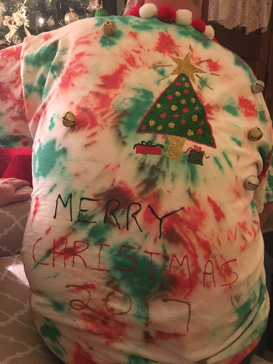 Tinascarps's tweet photo. We win the family Christmas party again! Yes... we're wearing shirts of our dog who's wearing a shirt of us #websters #christmas #repeatwin @kevweb20 https://t.co/gwrtIPHMhk