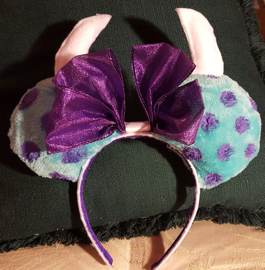 BUY Online From Here: bit.ly/2BlrJn1 Monsters Inc. Sully Themed Mickey Mouse Ears Headband by rings42000 Handmade Monsters Inc. Sully themed Mickey Mouse Ears headband. Soft blue fur ears with purple spots, white horns, and a purple bow.