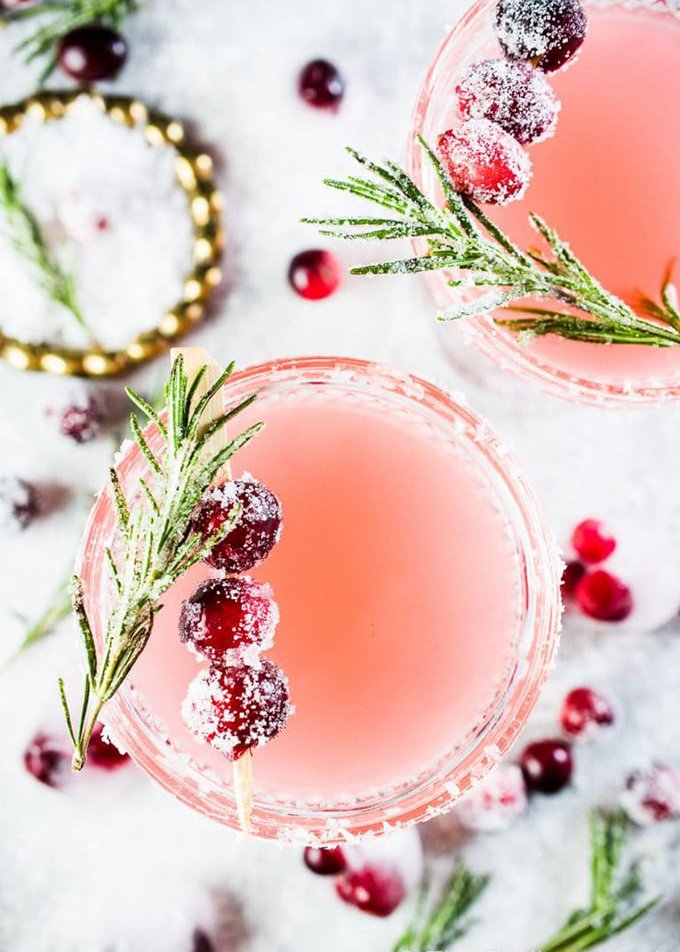 TheEndlessMeal's tweet photo. This pretty and delicious Cranberry #Margarita is perfect for #Christmas parties. Cranberries are muddled with tequila, lime juice, and an easy to make rosemary simple syrup then shaken over ice. If you like margaritas, you will love this #cocktail! https://t.co/udhaFlrqk3 https://t.co/bmnfL5phPq