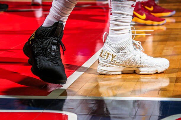darrenrovell's tweet photo. LeBron goes with one black &amp; one white “Equality” shoe tonight in D.C. (📷 by Ned Dishman/Getty) https://t.co/TBDusP4IC4