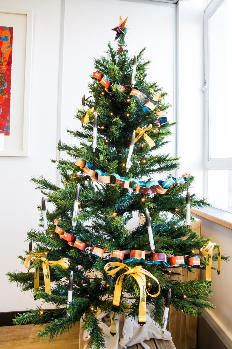 CreativeMPC's tweet photo. A bit late but we have finally put the tree up at the Bristol office and everyone has been getting into the Christmas spirit making our own decorations from @Engagement2017 left over merch #MerryChristmas #handmadechristmas  #ChristmasTree https://t.co/iafCOSaagP