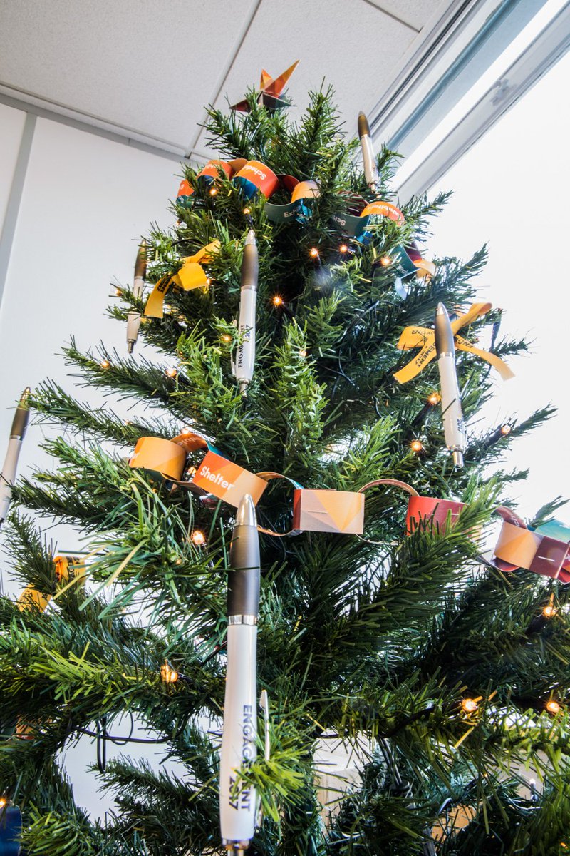 CreativeMPC's tweet photo. A bit late but we have finally put the tree up at the Bristol office and everyone has been getting into the Christmas spirit making our own decorations from @Engagement2017 left over merch #MerryChristmas #handmadechristmas  #ChristmasTree https://t.co/iafCOSaagP