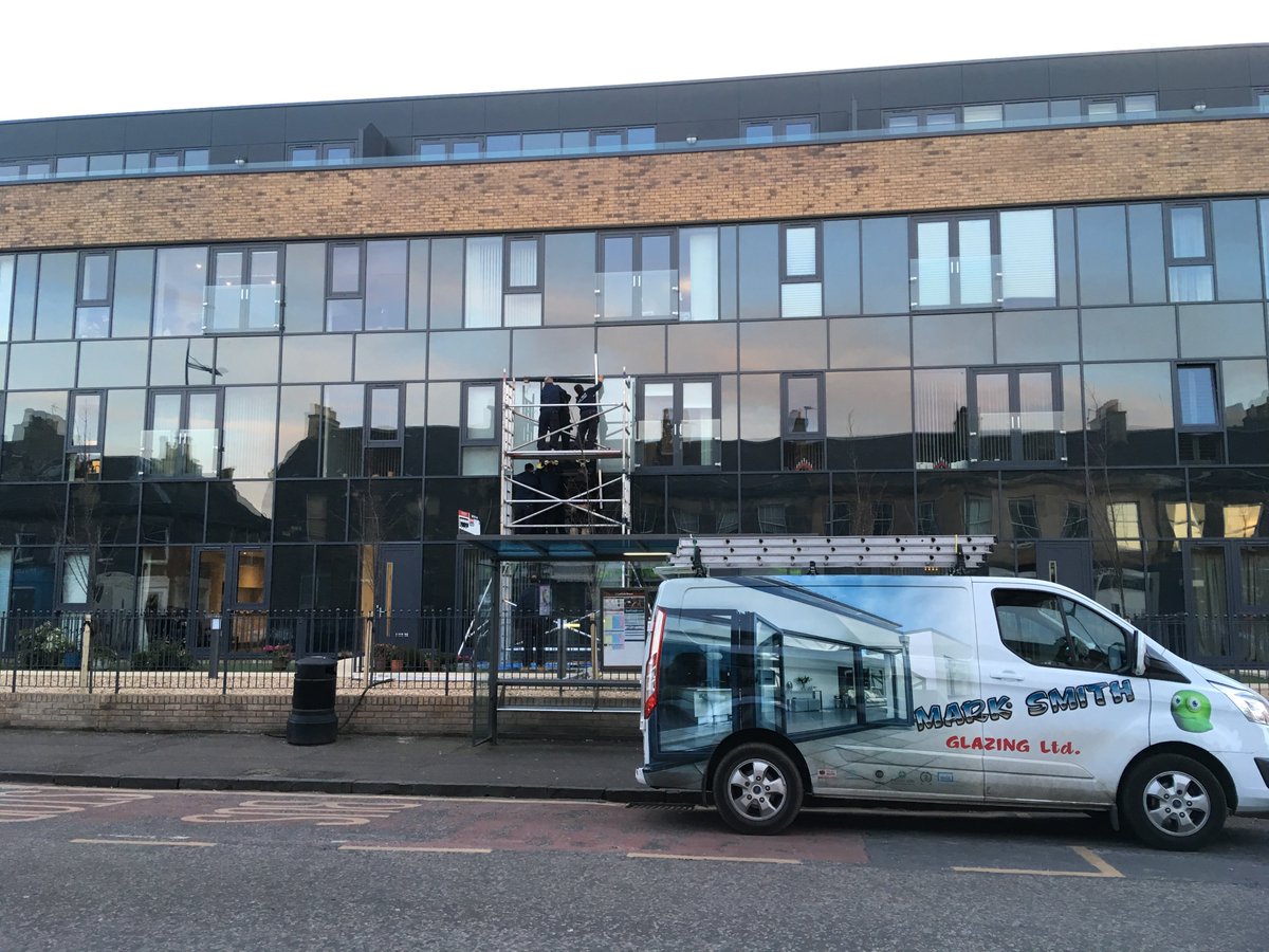 The team from Mark Smith Glazing installing a new painted-back double glazed unit to the development at 275 #Portobello High Street, opposite our office.