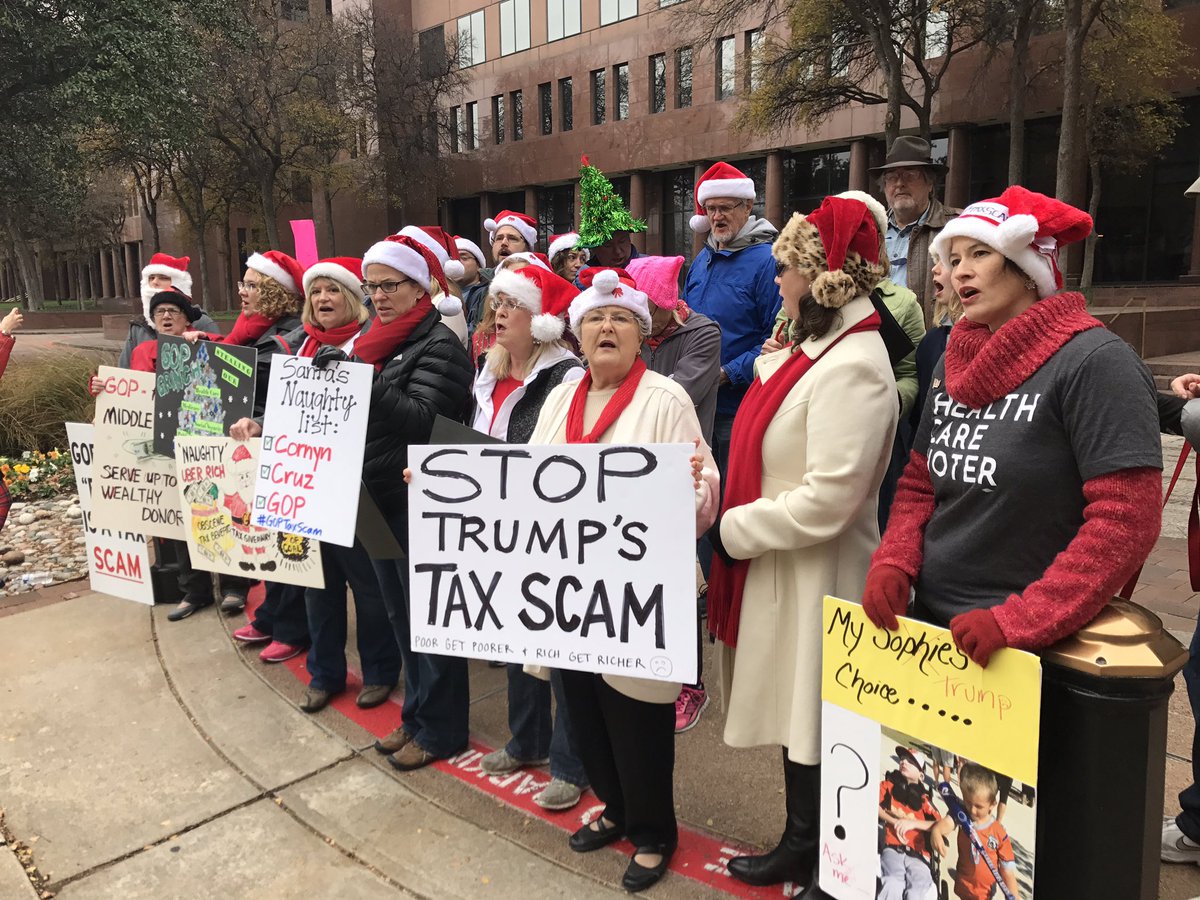 WBAP247NEWS's tweet photo. A group of protesters were caroling outside Sen @JohnCornyn Dallas office today to vent their frustrations about the GOP tax bill. The story at 2. https://t.co/FwExjPYBEg