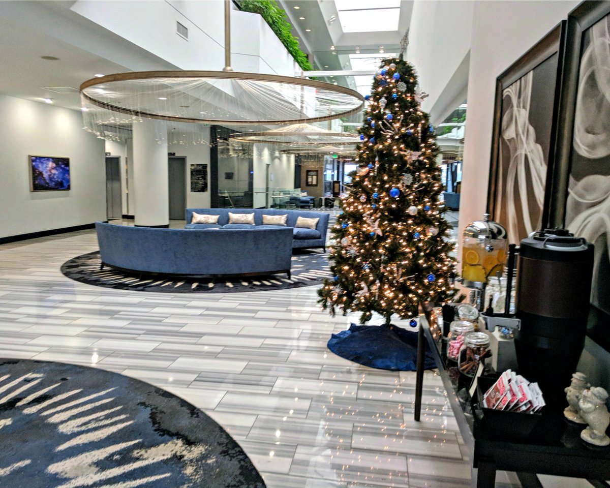 HiltonNASACL's tweet photo. We're in the holiday spirit and we're ready to share it with our guests! Be sure to snap a photo with the tree in our lobby. https://t.co/kj4ExiWvLh