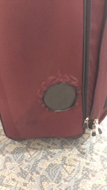 ronmasseo's tweet photo. @FlyFrontier Was told this is normal wear and tear Funny how when I checked this bag it didn’t have a huge burn hole in the side of it https://t.co/TS2VvOhHLq