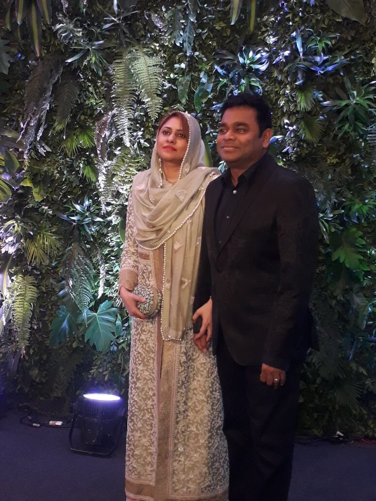 filmfare's tweet photo. Maestro @arrahman arrives with wife  at #Virushka’s #MumbaiReception. https://t.co/XkP8mD9V1l